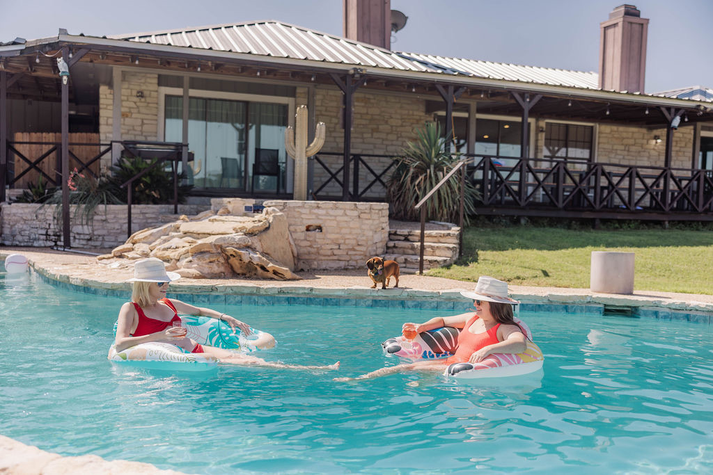 Floating in the pool below the house