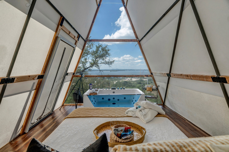 A soaking tub with a lake view